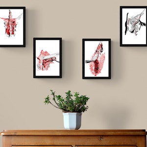 May include: Four framed black and white ink drawings with red accents. The drawings are of abstract shapes and lines.