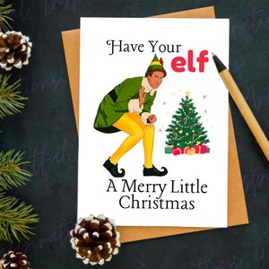 May include: A Christmas card featuring Buddy the Elf from the movie Elf. The card has a green and yellow illustration of Buddy in a festive pose with a Christmas tree and the text "Have Your Elf A Merry Little Christmas".