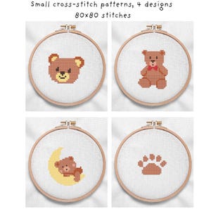 May include: Four small cross-stitch patterns featuring teddy bears and a paw print, displayed in wooden embroidery hoops. The text at the top reads "Small cross-stitch patterns, 4 designs 80x80 stitches."