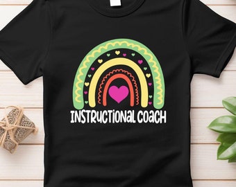 May include: Black t-shirt featuring a rainbow design and the text "Instructional Coach".