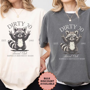 May include: Two t-shirts with a raccoon wearing sunglasses and the text "Dirty 30" and "Est. 1995" and "Social Club Sophia's Birthday Bash".