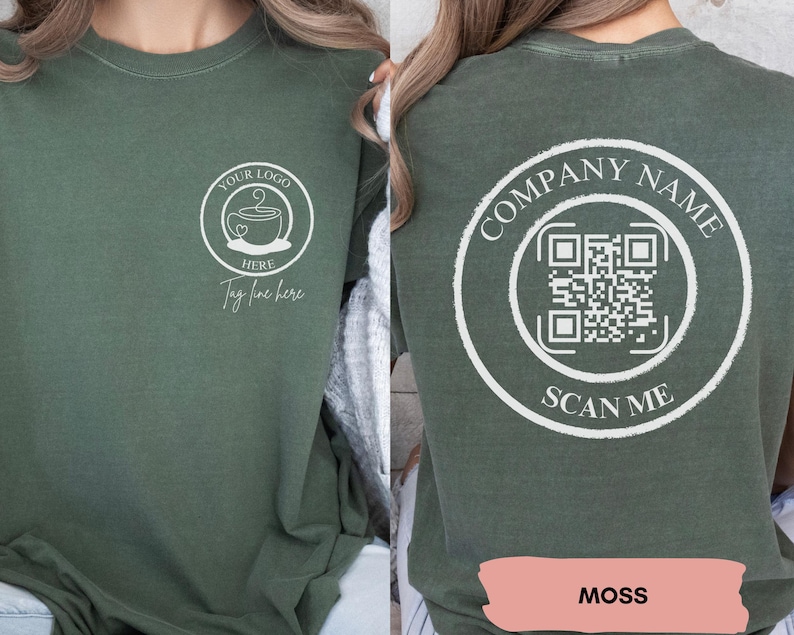 May include: A green long-sleeved t-shirt with a white design on the front that says "Your Logo Here" and a coffee cup with a heart. The back of the shirt has a white circle with the text "Company Name" and a QR code with the text "Scan Me". The shirt is labelled "Moss".