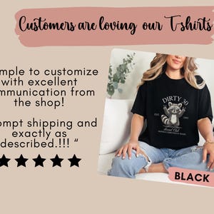 May include: A black t-shirt with a raccoon graphic and the text "Dirty 30 Social Club" and "Est. 1992". The t-shirt is being worn by a person sitting on a couch.