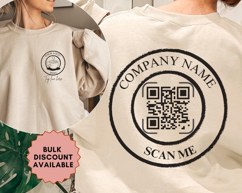 May include: A beige sweatshirt with a black logo on the front that says "YOUR LOGO HERE" and a black circle on the back with the text "COMPANY NAME" and a QR code that says "SCAN ME".