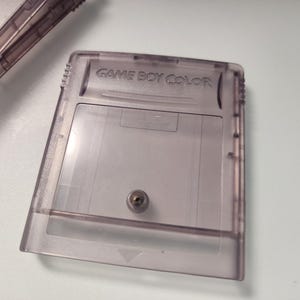 May include: A set of three ceramic mugs with a speckled, matte finish. The mugs are in shades of cream, light brown, and dark brown. Each mug has a simple, minimalist design, perfect for coffee or tea.