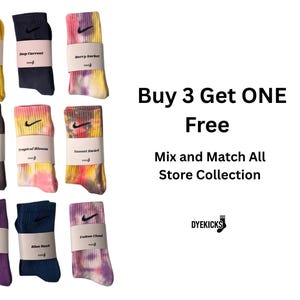 May include: A collection of colorful socks, each folded and wrapped with a label. The socks come in various colors, including pink, green, yellow, and tie-dye patterns. The Nike logo is visible on each sock. Text on the right side reads "Buy 3 Get ONE Free".