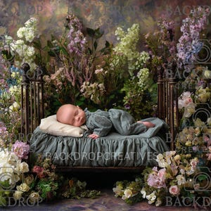 May include: A sleeping baby in a teal outfit rests on a small bed with a ruffled teal blanket and a cream pillow. The bed is surrounded by an array of colorful flowers, including white, pink, and purple blooms, against a painted backdrop.