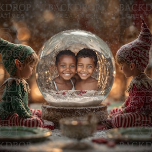 May include: A festive Christmas scene featuring a snow globe with two smiling children inside. Two elf figures in green and red outfits flank the globe. The scene is set with plates and a warm, blurred background.