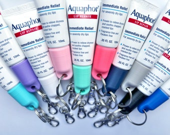 Tapa de llavero Aquaphor - Reparación de labios Aquaphor 0.35 FL OZ(10mL) - Soporte para bálsamo labial - Accesorio para bolso - Accesorio para cordón - Llavero con brillo labial