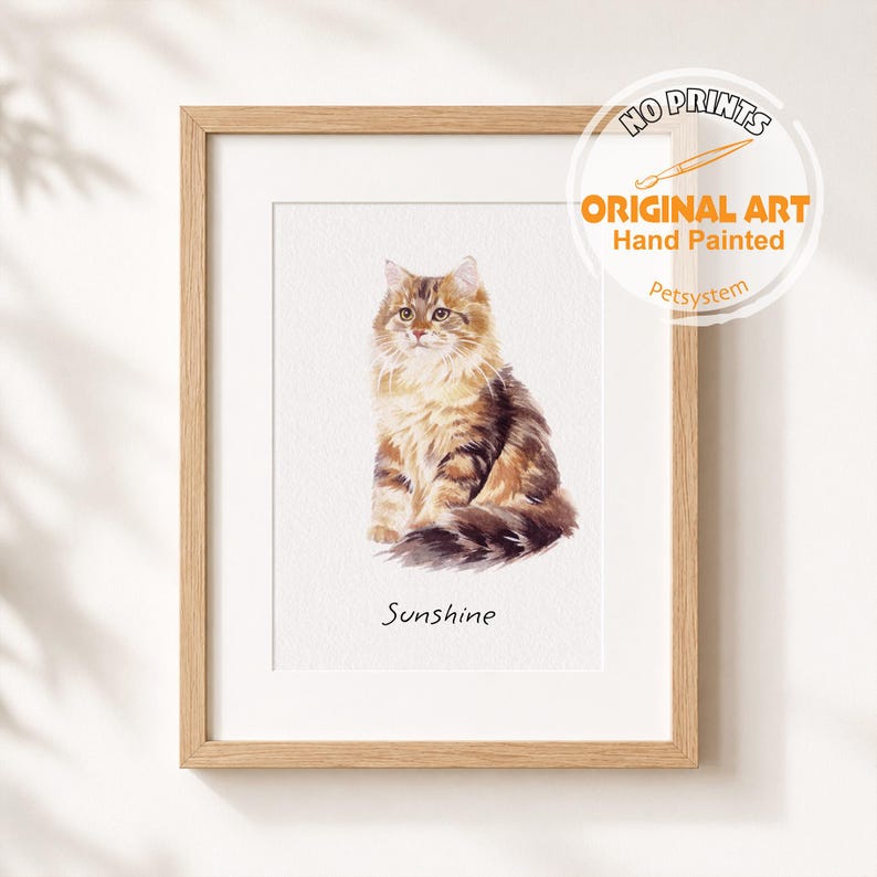 May include: A framed watercolour painting of a fluffy brown and tan tabby cat sitting upright. The cat has long fur and a bushy tail. Below the cat, the word Sunshine is printed in black text. A circular logo in the corner reads NO PRINTS ORIGINAL ART.