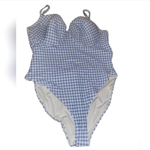 May include: A blue and white gingham one-piece swimsuit with a sweetheart neckline and adjustable straps.