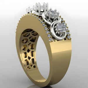 May include: A gold band ring with a white gold infinity symbol design set with small diamonds. The ring has a delicate, intricate design and is a beautiful piece of jewelry.