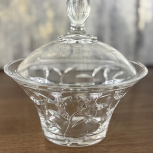 Glass Candy Jar with Lid Barneys New York Clear Decorative Pot for Jewelry Storage Vanity Decor or Elegant Kitchen Counter Display