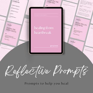 May include: A digital tablet displaying a pink screen with the words "healing from heartbreak." Surrounding the tablet are pink cards with text, and the words "Reflective Prompts" are written in cursive below. The image is designed to help you heal.