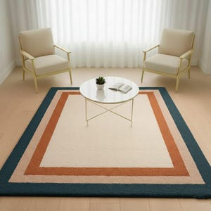 Alfombra moderna rectangular con cenefa, lana tufted a mano en crema, óxido y verde azulado