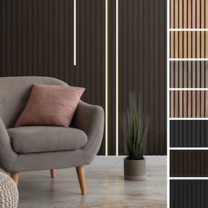 May include: A grey armchair with a pink cushion sits in front of a dark brown wood wall with vertical slats. A small potted plant sits on the floor in front of the chair. The wall is shown with different wood colours and patterns in a sample panel on the right side of the image.