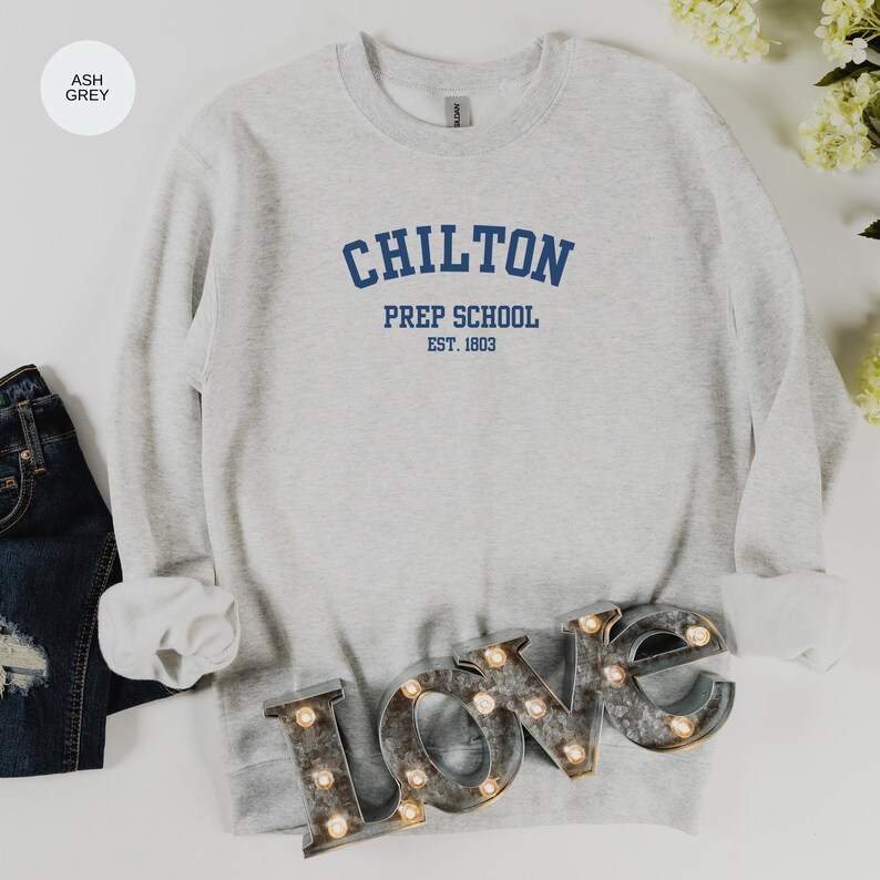May include: Ash grey sweatshirt with the text "Chilton Prep School Est. 1803" in blue.