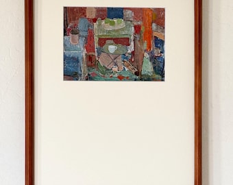 Puede incluir: Un cuadro enmarcado que muestra una escena interior abstracta con una mesa, una taza blanca y fruta verde. La obra está contenida en un marco de madera rectangular con un borde blanco ancho, destacando una aplicación de pintura texturizada.