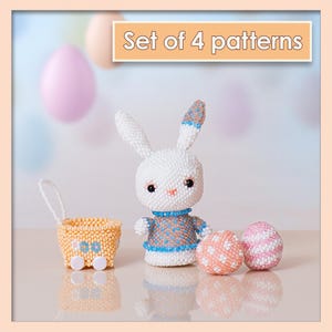 May include: A white beaded bunny figurine with blue and brown accents, a small yellow basket, and two decorative eggs. The text "Set of 4 patterns" is displayed above the objects. The bunny is wearing a blue and brown sweater.