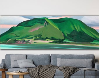 May include: A painting of a green mountain with a pink sky in the background. The mountain is reflected in the water in the foreground.