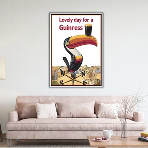 May include: A vintage Guinness advertisement featuring a toucan holding a glass of Guinness with the text "Lovely day for a Guinness".