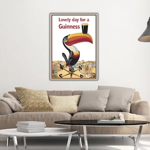 May include: A vintage Guinness advertisement featuring a toucan holding a glass of Guinness with the text "Lovely day for a Guinness".