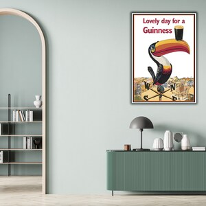 May include: A vintage Guinness advertisement featuring a toucan holding a glass of Guinness with the text "Lovely day for a Guinness".