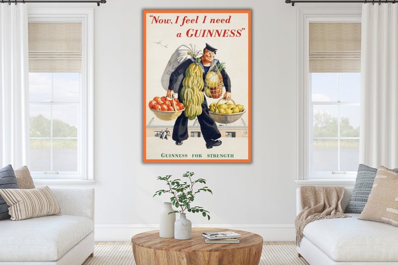 May include: A vintage Guinness advertisement featuring a man carrying a variety of produce, including bananas, pineapples, lemons, and tomatoes. The text reads "Now, I feel I need a GUINNESS" and "GUINNESS FOR STRENGTH".