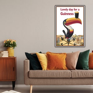 May include: A vintage Guinness advertisement featuring a toucan holding a glass of Guinness with the text "Lovely day for a Guinness".