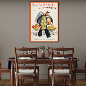 May include: Vintage Guinness advertisement featuring a cartoon sailor carrying a large sack of potatoes and two baskets of fruit. The text reads "Now, I feel I need a GUINNESS" and "GUINNESS FOR STRENGTH".