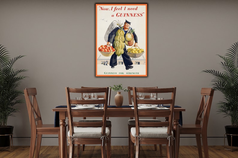 May include: Vintage Guinness advertisement featuring a cartoon sailor carrying a large sack of potatoes and two baskets of fruit. The text reads "Now, I feel I need a GUINNESS" and "GUINNESS FOR STRENGTH".