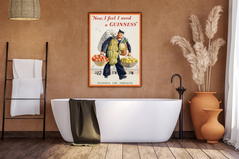 May include: Vintage Guinness advertisement featuring a man carrying a large amount of fruit and vegetables. The text reads "Now, I feel I need a GUINNESS." and "GUINNESS FOR STRENGTH."