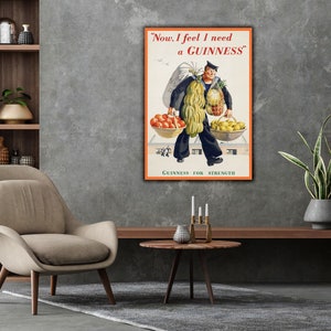 May include: A vintage Guinness advertisement featuring a man carrying a basket of fruit and a pineapple. The text reads "Now, I feel I need a GUINNESS." and "GUINNESS FOR STRENGTH".