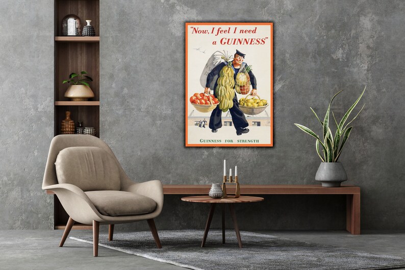 May include: A vintage Guinness advertisement featuring a man carrying a basket of fruit and a pineapple. The text reads "Now, I feel I need a GUINNESS." and "GUINNESS FOR STRENGTH".