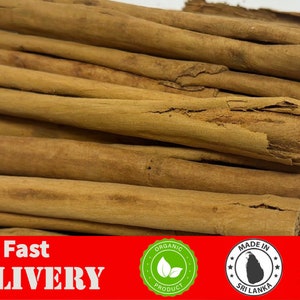 May include: A close-up of a pile of brown cinnamon sticks. The sticks are arranged in a random pattern and are all of similar size. The sticks are dry and have a rough texture. The text "Free & Fast DELIVERY" is visible at the bottom of the image. The text "ORGANIC PRODUCT" is visible in a green circle at the bottom left of the image. The text "MADE IN SRI LANKA" is visible in a white circle with a blue outline at the bottom center of the image. The text "ORIGINAL 100%" is visible in a yellow circle with a red outline at the bottom right of the image.