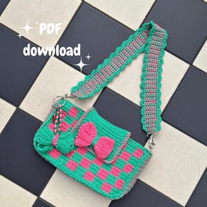 May include: A handmade crochet bag in a checkerboard pattern of bright green and pink. The bag features a pink bow and a matching strap with a scalloped edge. The text "PDF download" is visible in the image.