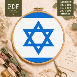 May include: A cross stitch pattern featuring a blue Star of David centered on a white background within a wooden embroidery hoop. The design includes text indicating it is a PDF instant download with 100x100, 150x150, and 200x200 stitch options.