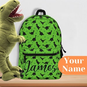 Sac à dos dinosaure personnalisé | Sac vert avec silhouettes de dinosaures noires | Cartable personnalisé pour enfants | Cadeau durable et élégant
