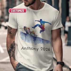 May include: White t-shirt featuring a watercolor design of a person jumping over a wall, with running shoes and the name "Anthony 2026" printed below. The word "Customize" is in a red box at the top.