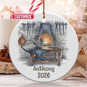 May include: A round ceramic Christmas ornament featuring a blacksmith's workshop scene. The design includes a forge, anvil, tools, and the text "Anthony 2026". The word "Customize" is also visible.