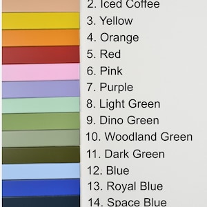 May include: A color chart featuring fifteen horizontal rectangular strips arranged in a vertical column. Each strip corresponds to a numbered label from 1 to 15, listing colors including white, iced coffee, yellow, orange, red, pink, purple, light green, dino green, woodland green, dark green, blue, royal blue, space blue, and black.
