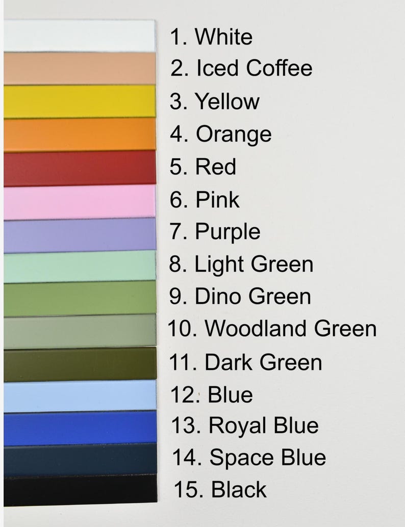 May include: A color chart featuring fifteen horizontal rectangular strips arranged in a vertical column. Each strip corresponds to a numbered label from 1 to 15, listing colors including white, iced coffee, yellow, orange, red, pink, purple, light green, dino green, woodland green, dark green, blue, royal blue, space blue, and black.