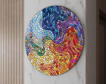 May include: A colorful circular wall art piece with a mosaic design. The mosaic is made up of small, colorful squares and rectangles that are arranged in a swirling pattern. The colors in the mosaic include blue, green, yellow, orange, and red.