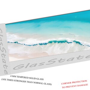 May include: A panoramic view of a beach with turquoise water and white waves crashing on the shore. The image is printed on a 4 mm tempered solid glass panel, which is 10 times stronger than normal glass. The glass panel has corner protection to prevent damage.