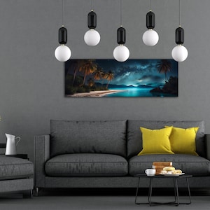 May include: A living room interior with a grey sofa and two yellow throw cushions. A black coffee table with a cup and saucer and a plate of pastries sits in front of the sofa. A grey ottoman sits to the right of the sofa. A black metal tray with a vase of yellow sunflowers sits on a black metal side table to the left of the sofa. A panoramic photograph of a tropical beach scene with palm trees and a starry sky hangs on the wall above the sofa. Six black and white pendant lights hang from the ceiling.