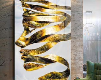 Arte de parede em vidro com perfil abstrato de rosto dourado: decoração moderna para casa