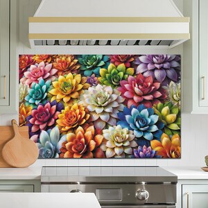 Può includere: Un primo piano colorato di una varietà di piante grasse in tonalità di rosa, viola, verde, giallo e arancione.