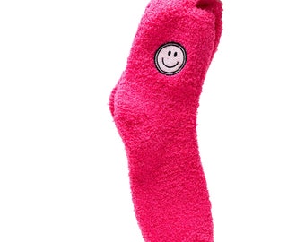 Calcetines borrosos con cara sonriente rosa fuerte