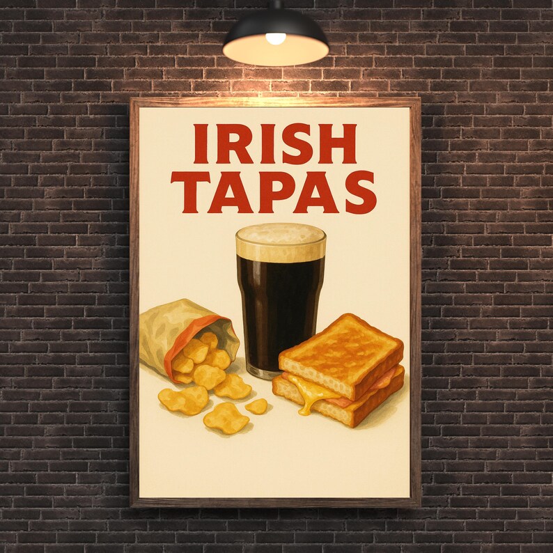 May include: A framed poster with the words "IRISH TAPAS" in red. The image features a pint of dark beer with foam, a bag of chips, and two grilled cheese sandwiches. The background is a brick wall.