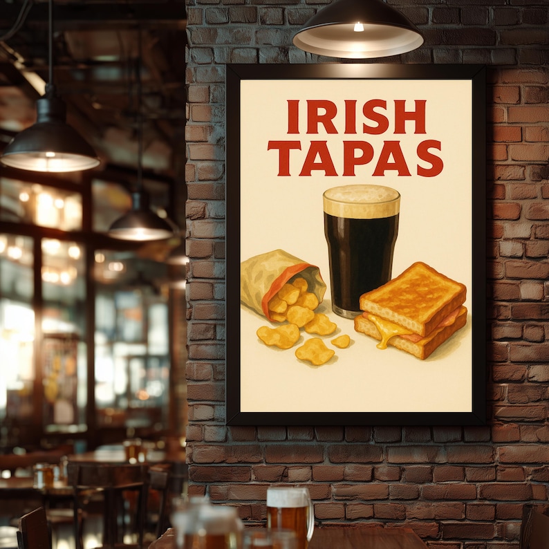 May include: A framed poster with the words "IRISH TAPAS" in red. The poster depicts a pint of dark beer, a bag of chips, and two grilled cheese sandwiches. The background is a brick wall.